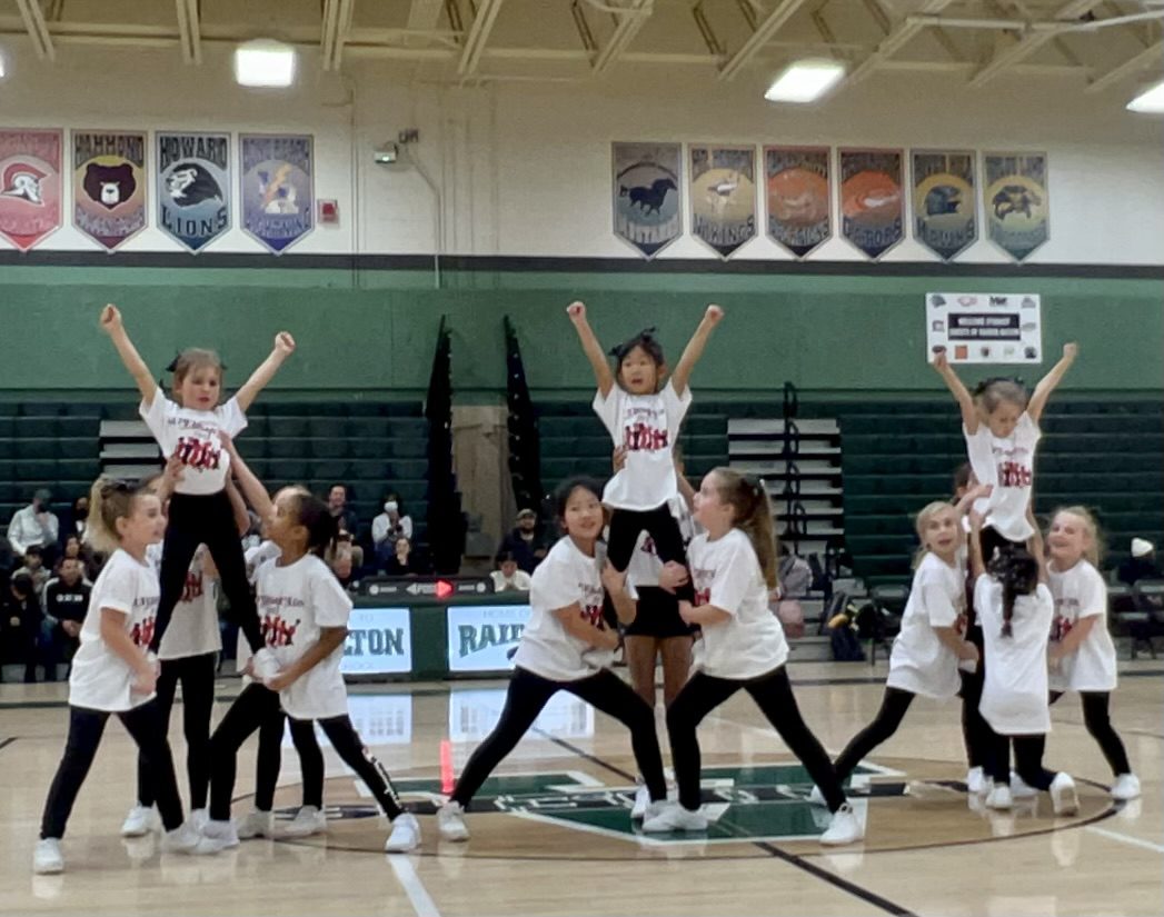 SuperSquads stunt groups performing at a high school basketball game